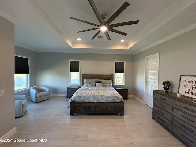 bedroom with ceiling fan, light hardwood / wood-style flooring, and multiple windows