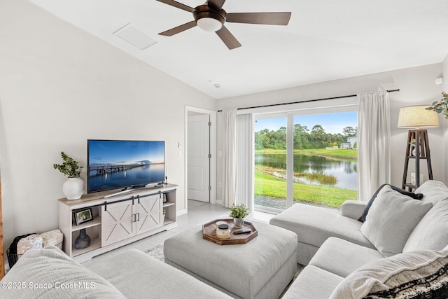 living room featuring ceiling fan and lofted ceiling