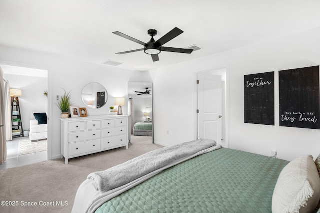 bedroom with light colored carpet and ceiling fan