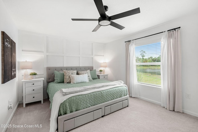 bedroom featuring ceiling fan and light carpet