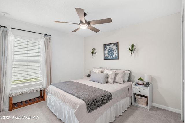 bedroom with light colored carpet and ceiling fan