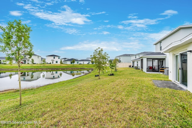 view of yard with a patio area and a water view