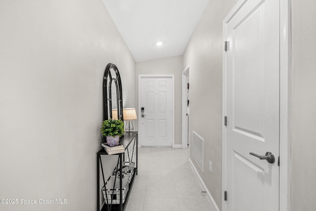 corridor with lofted ceiling