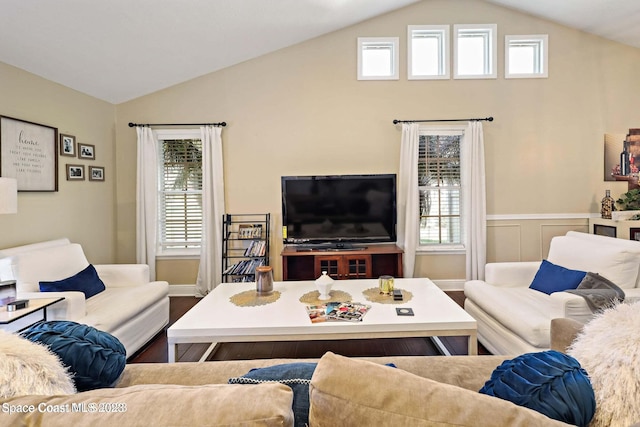 living room with hardwood / wood-style floors and lofted ceiling