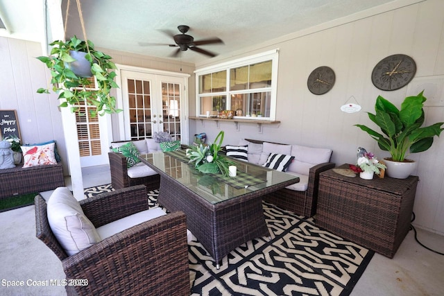 view of patio / terrace with ceiling fan, an outdoor living space, and french doors