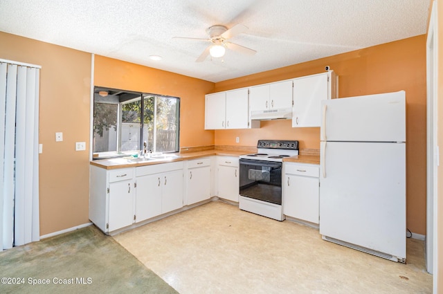 kitchen with a textured ceiling, white appliances, light colored carpet, sink, and white cabinetry