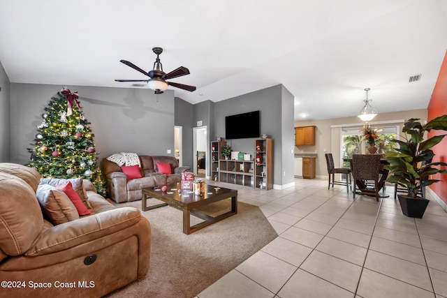 2773 San Filippo Dr SE, Palm Bay, FL 32909 - living room with light tile patterned flooring, a ceiling fan, and lofted ceiling