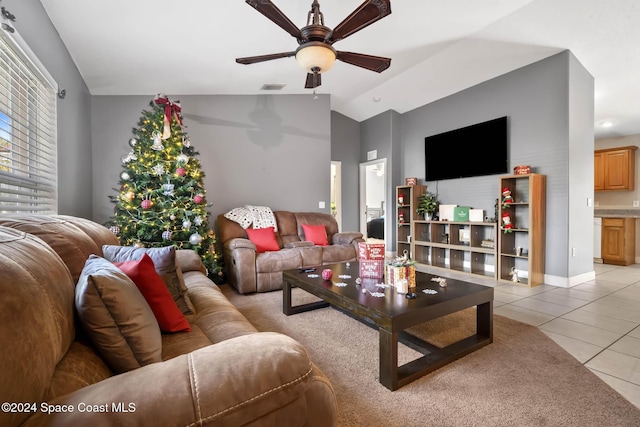 2773 San Filippo Dr SE, Palm Bay, FL 32909 - living area featuring light tile patterned flooring, ceiling fan, and vaulted ceiling