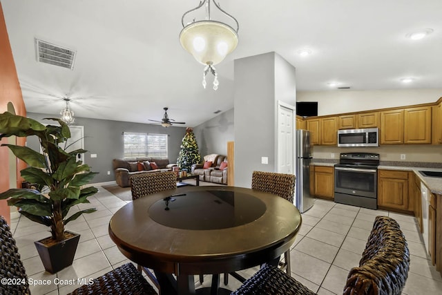 2773 San Filippo Dr SE, Palm Bay, FL 32909 - dining room with lofted ceiling, light tile patterned floors, a ceiling fan, and recessed lighting