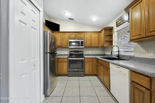 2773 San Filippo Dr SE, Palm Bay, FL 32909 - kitchen with appliances with stainless steel finishes, brown cabinets, light tile patterned flooring, lofted ceiling, and open shelves