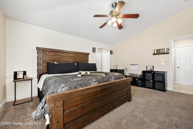 bedroom with light colored carpet, ceiling fan, and lofted ceiling