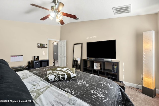 carpeted bedroom featuring ceiling fan and vaulted ceiling