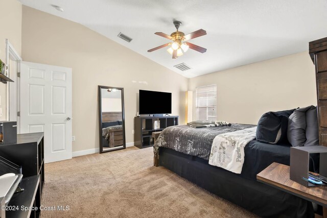 2773 San Filippo Dr SE, Palm Bay, FL 32909 - bedroom featuring lofted ceiling, light carpet, and a ceiling fan