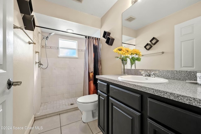 bathroom featuring a shower with curtain, tile patterned flooring, vanity, and toilet