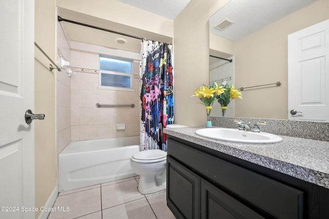 full bathroom featuring vanity, tile patterned floors, shower / bath combination with curtain, toilet, and a textured ceiling