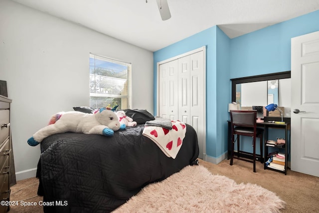 carpeted bedroom with a closet and ceiling fan