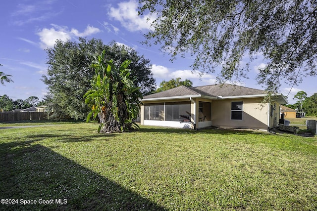 2773 San Filippo Dr SE, Palm Bay, FL 32909 - rear view of house with a sunroom and stucco siding