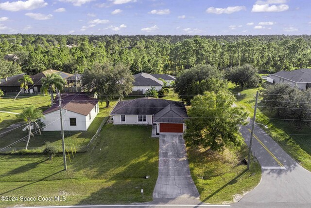 2773 San Filippo Dr SE, Palm Bay, FL 32909 - drone / aerial view of a heavily wooded area