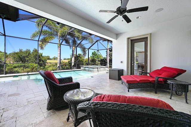 view of patio / terrace with a pool with hot tub, ceiling fan, a lanai, and an outdoor hangout area