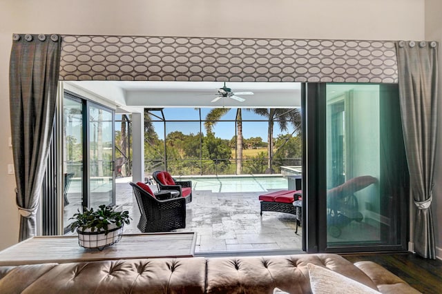 sunroom / solarium with ceiling fan