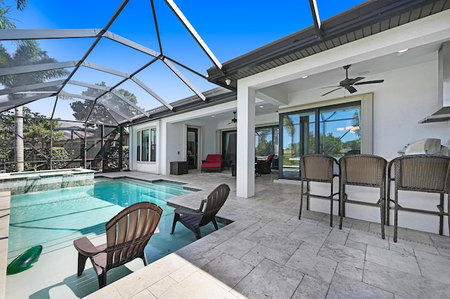 view of swimming pool with an outdoor bar, ceiling fan, a lanai, an in ground hot tub, and a patio area