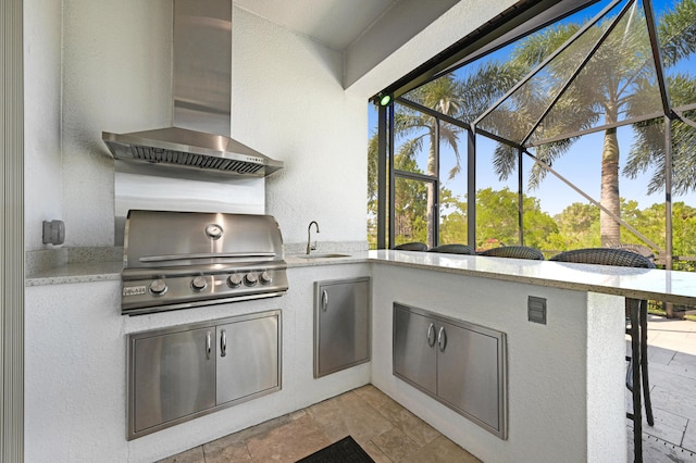 view of patio featuring area for grilling, a lanai, and sink