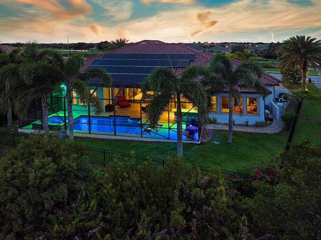 exterior space with a patio area, a fenced in pool, and a yard