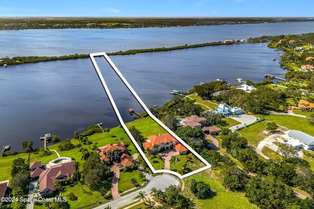 4760 Honeyridge Ln, Merritt Island, FL 32952 - aerial view of residential area featuring a nearby body of water and property parcel outlined