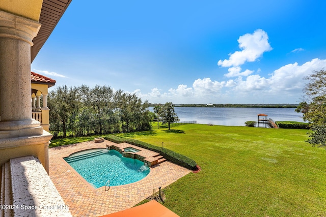 4760 Honeyridge Ln, Merritt Island, FL 32952 - view of pool with a water view, a yard, a pool with connected hot tub, and a patio