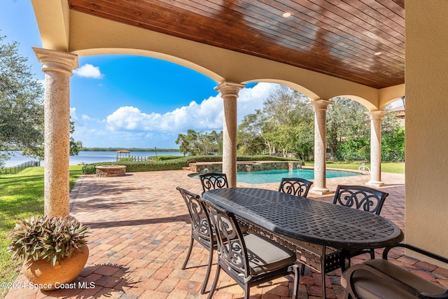 view of patio / terrace with a water view