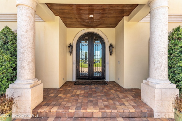 property entrance featuring french doors