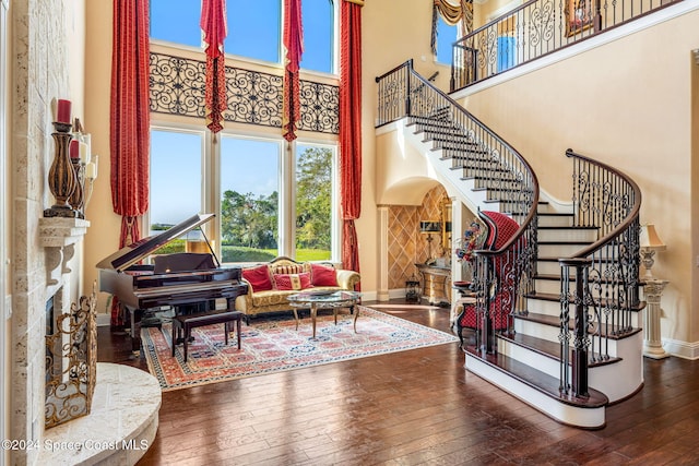 interior space with a high ceiling and hardwood / wood-style floors