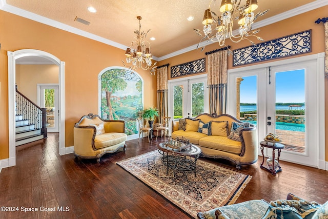 living room featuring dark hardwood / wood-style flooring, crown molding, french doors, and a textured ceiling