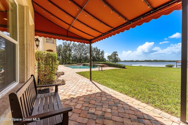 view of patio featuring a water view