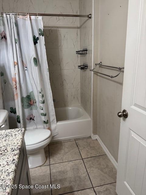 full bathroom with tile patterned flooring, toilet, vanity, and shower / bathtub combination with curtain