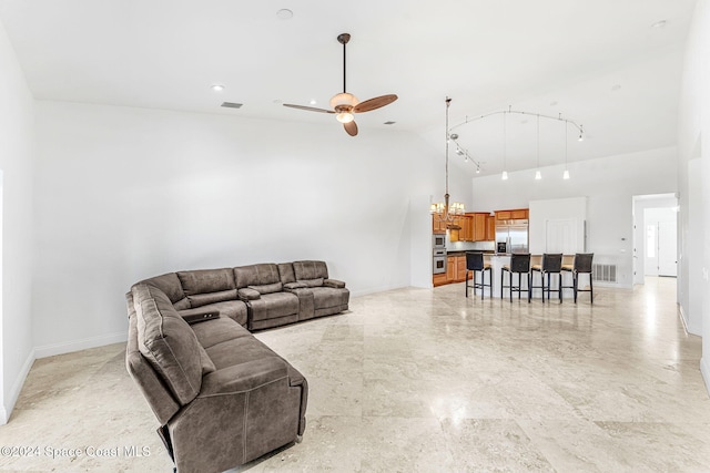 living room featuring high vaulted ceiling and ceiling fan