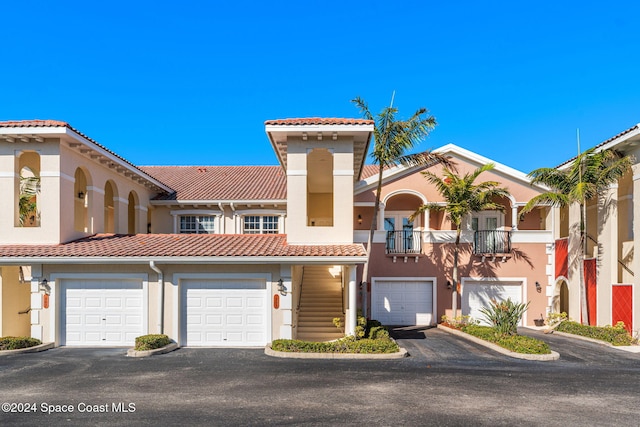 view of front of house with a balcony and a garage