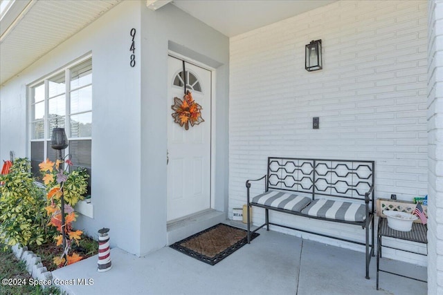 entrance to property featuring a porch