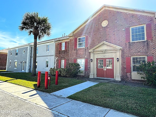 view of property with a front yard