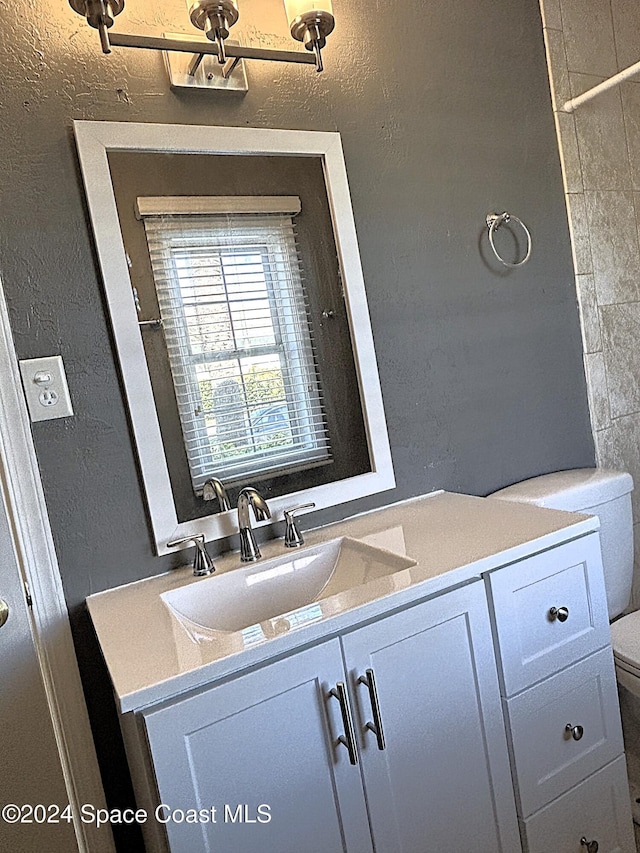 bathroom with vanity and toilet