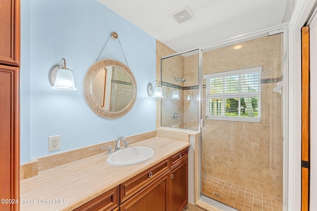 bathroom featuring vanity and walk in shower