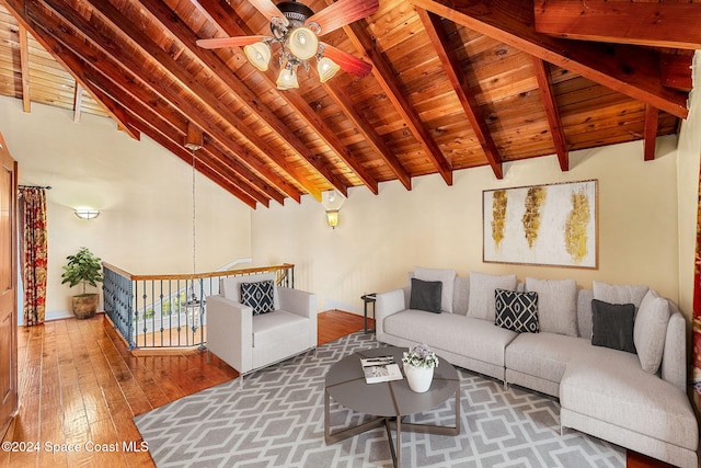 living room with hardwood / wood-style flooring, ceiling fan, beam ceiling, and high vaulted ceiling