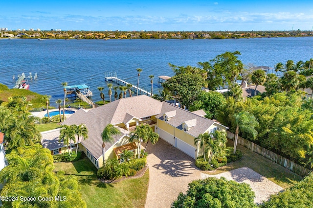 birds eye view of property with a water view