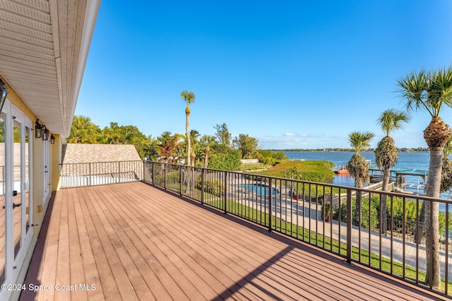 wooden deck with a water view