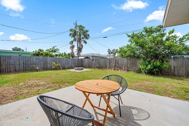 view of patio / terrace with an outdoor fire pit