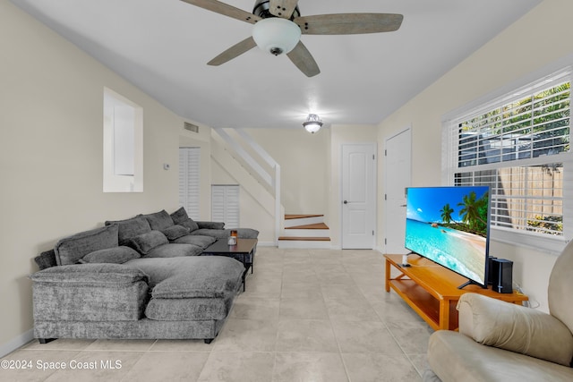 516 S Plumosa St Unit 20, Merritt Island, FL 32952 - living area featuring a ceiling fan, stairs, and tile patterned flooring