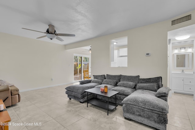 516 S Plumosa St Unit 20, Merritt Island, FL 32952 - living area with ceiling fan and light tile patterned floors