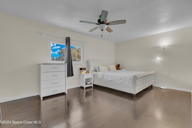 bedroom featuring ceiling fan and dark hardwood / wood-style floors