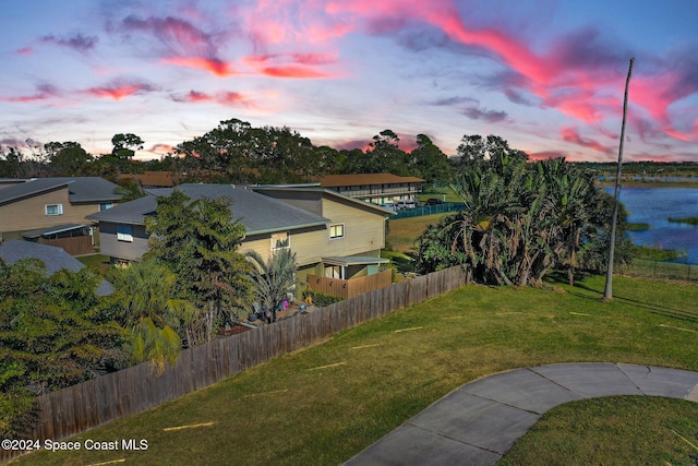 516 S Plumosa St Unit 20, Merritt Island, FL 32952 - yard at dusk with a water view