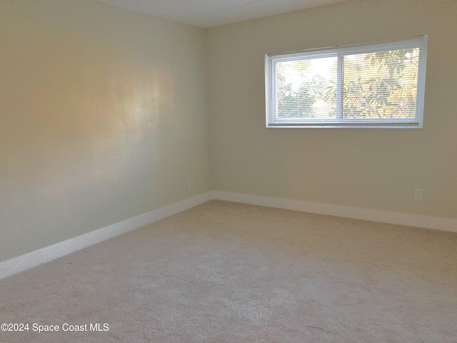 unfurnished room with carpet floors